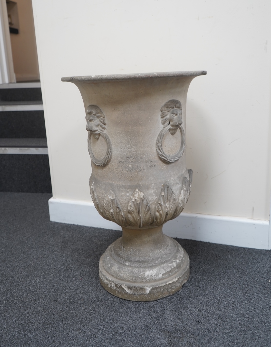 A 19th century circular earthenware urn